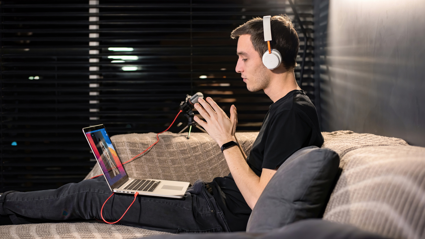 Young Male Content Creator Recording on His Laptop